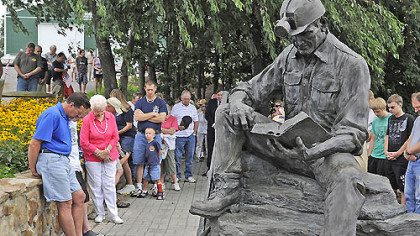 Participants gather at the entrance of the Quecreek mine rescue site for a prayer during the 10th anniversary celebration.