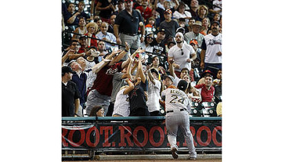 Pirates' Pedro Alvarez chases a foul ball during the second inning.