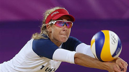 April Ross of US dives for a ball during the Beach Volleyball match against Argentina at the 2012 Summer Olympics, Sunday, July 29, 2012, in London.