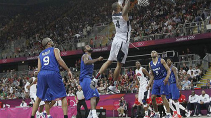 USA's Tyson Chandler (4) goes in for a dunk during the second half of a preliminary men's basketball game against France at the 2012 Summer Olympics, Sunday, July 29, 2012, in London.