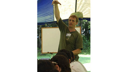 Jeff Gilbert, who runs his own solar tech company, teaches students about a growing energy industry.