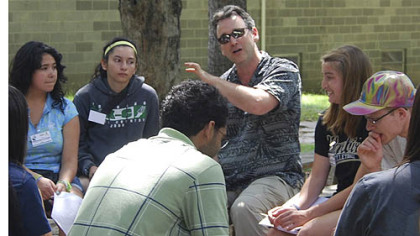 Students discuss the intersections of science and morality in a small-group class session.