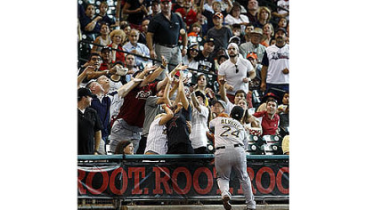 Pirates' Pedro Alvarez chases a foul ball during the second inning.