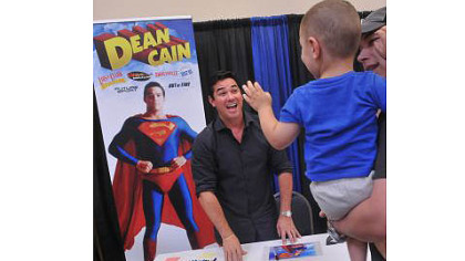 Dean Cain, who played Superman in the TV series "Lois and Clark," has a big smile for 2-year-old Brycen Bedard of Pittsburgh at the Steel City Con in Monroeville Convention Center.