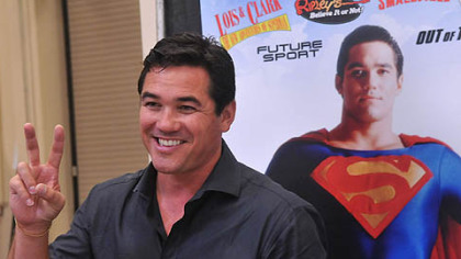 Dean Cain, who played Superman in the TV series "Lois and Clark," flashes a victory sign to people who came to get his autograph at Steel City Con.