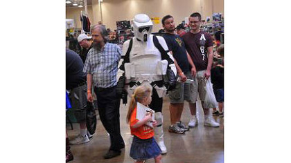 A "Star Wars" Stormtrooper parades down aisles during the wind-down of the Steel City Con at the Monroeville Convention Center.