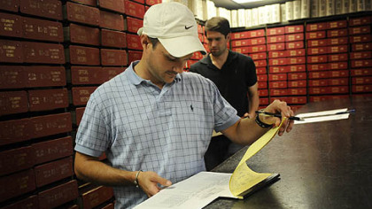 Ben Suitt, a subcontractor for oil and gas companies, researches deeds in the recorder of deeds archive Thursday at the Lisbon County Courthouse in Lisbon, Ohio.