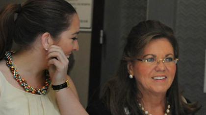 Judge Joan Orie Melvin (right) walks out of the courtoom with her daughter Casey, during a break in testimony today.