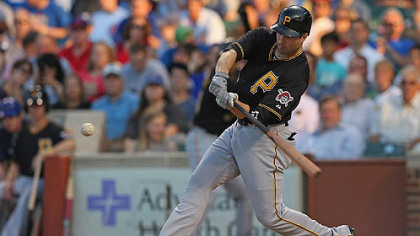 The Pirates' Neil Walker hits a grand slam home run in the first inning against the Chicago Cubs at Wrigley Field.