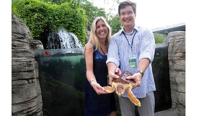 Chairs Anita and Joe Moran with "Carson" the sea turtle.
