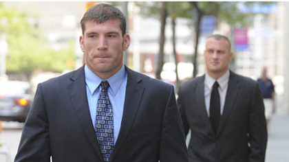 Pittsburgh police officers Michael Saldutte, left, and Richard Ewing arrive Tuesday at the U.S. District Court.