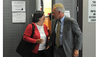 Lisa Sasinoski, the former chief law clerk of state Supreme Court Justice Joan Orie Melvin, leaves the courtroom Monday after her testimony.