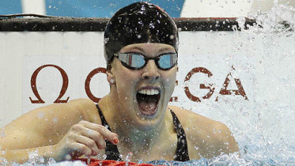 United States' (and Pittsburgh's) Allison Schmitt celebrates her gold medal win in the women's 200-meter freestyle swimming final.