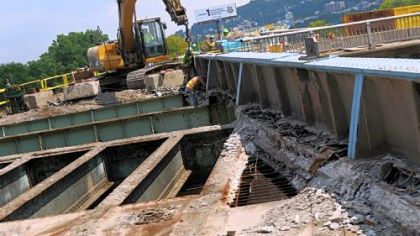 Construction crews work alongside Route 28 Tuesday at the interchange with the 31st Street Bridge.