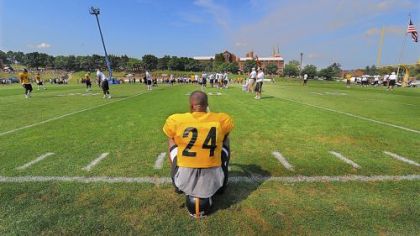 Ike Taylor takes a break during workouts.