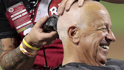Reds broadcaster Marty Brennaman said he'd shave his head if the Reds won 10 in a row. They reached 10 last Sunday and Friday he paid off on the field at Great American Ball Park.