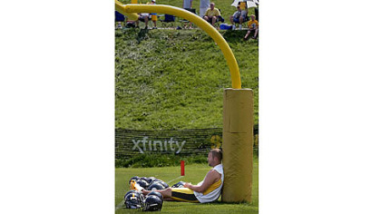 Ben Roethlisberger finds a place to try to catch a break from the heat and humidity Saturday at the Saint Vincent College training camp.