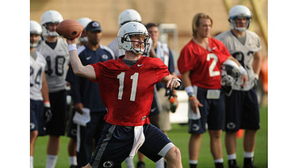 Penn State quarterback Matt McGloin throws during NCAA college football practice today in State College. The team held its first formal workouts since the NCAA leveled strict sanctions against the program, including a four-year bowl ban, for the Jerry Sandusky child sex abuse scandal.