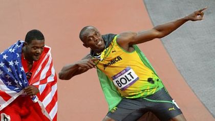 Gold medalist Jamaica's Usain Bolt celebrates with bronze medalist Justin Gatlin of the U.S. after winning the men's 100m final.