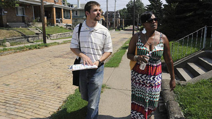 Steve Novotny, the Sheraden Community coordinator, and Tammy Thompson of NeighborWorks Western PA, go door-to-door giving out information in Sheraden on issues in the community, including foreclosures and other housing issues.