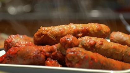Cooked Italian sausage, prepared by Karen Panella as part of a meal following preparation of sopressata.