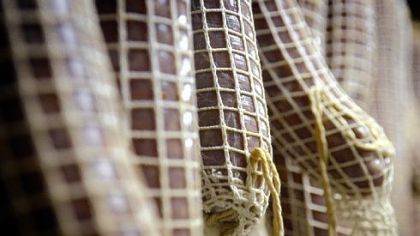 Sopressata hangs to dry in the Panellas' Prospect basement.
