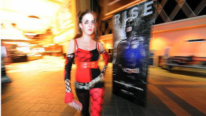 Amanda Kitchen, 22, of White Oak makes an early entrance as "Harley Quinn," a Batman character, to the midnight showing of "The Dark Knight Rises."