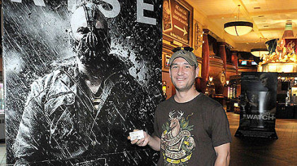 Bryan Dickey of Elliott was at the Waterfront today to purchase his ticket for "The Dark Knight Rises," which opens Friday at midnight. Mr. Dickey, who works Downtown, says he is eager to watch the movie after parts of it were filmed in the city last summer.