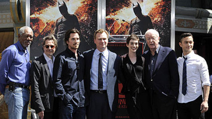 "The Dark Knight Rises" director Christopher Nolan, fourth from left, poses Saturday with cast members at his hand and footprint ceremony at Grauman's Chinese Theatre in Los Angeles.