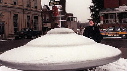 In this 1997 photo, Mars police officer Rhonda Rearick reacts with a howl when asked about the spaceship located in the town's center.