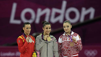 U.S. gold medallist gymnast Alexandra Raisman, center, Romania's silver medallist Catalina Ponor, left, and bronze medallist Russia's Aliya Mustafina display their medals during the podium ceremony of the artistic gymnastics women's floor exercise final at the 2012 Summer Olympics, Tuesday Aug. 7, 2012, in London.