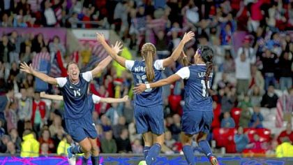 Alex Morgan, center, celebrates with Abby Wambach, left, and Sydney Leroux after scoring the winning goal Monday.