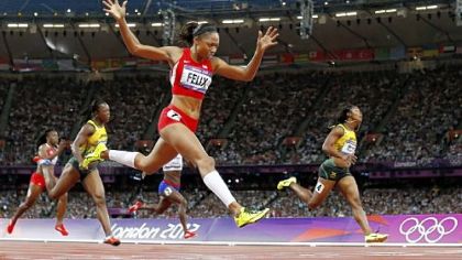 After settling for silver twice, Allyson Felix drives to the finish of her first Olympic gold medal in the women's 200-meter dash Wednesday in London.