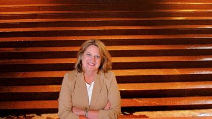 Terri Gregos of BNY Mellon stands inside the company's Grant Street building in Downtown Pittsburgh. BNY Mellon is one of nine companies teamed up with Vibrant Pittsburgh and OpssPlace.com to promote and attract a diverse workforce to the Pittsburgh area. "When people look at things differently, that's when you have the real power to solve and tackle issues and problems," says Ms. Gregos.