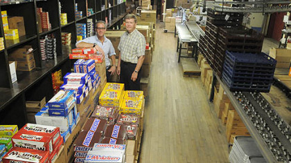 Jon Prince, president of McKeesport Candy Co., and Tom Griffin, executive manager, stand in the warehouse that the company has occupied since 1927. With the advent of the Internet, the company specializes in selling retro, novelty and themed candy.