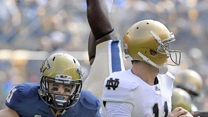 Pitt's Andrew Taglianetti, putting pressure on Notre Dame quarterback Tommy Rees during a game last season, has been nominated for the Allstate AFCA Good Works Team for his efforts on the field, in the community and classroom.