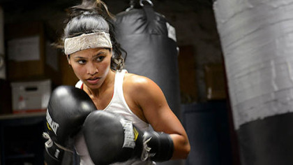 Jennifer Dugwen Chieng hits a punching bag as a part of her daily training routine Tuesday at the Third Avenue Boxing Gym in Downtown Pittsburgh.