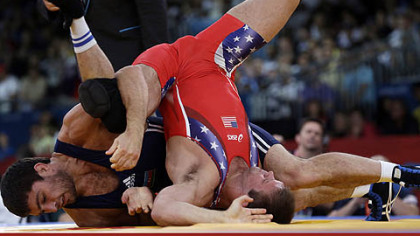 Wexford's Jake Herbert competes against Sharif Sharifov of Azerbaijan (in blue) during the men's 84-kg freestyle wrestling competition today in London.