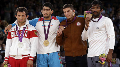 The medalists pose after the men's 60-kg freestyle wrestling competition. From left to right: silver medalist Besik Kudukhov of Russia, gold medalist Toghrul Asgarov of Azerbaijan,  bronze medalist Coleman Scott (from Waynesburg) of the United States and bronze medalist Yogeshwar Dutt of India.