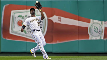 The Pirates' Andrew McCutchen pulls in a fly ball hit by the Padres' Carlos Quentin in the third inning.