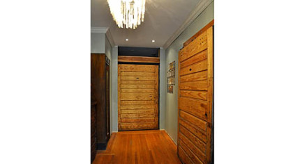 Melissa and Stephen Neely of Point Breeze reused old freezer doors as hanging barn doors.