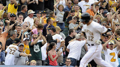 Fans cheer for Clint Barmes after he hit a grand in the fourth inning.
