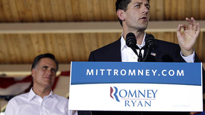 Republican presidential candidate, former Massachusetts Gov. Mitt Romney, left, listens as vice presidential running mate Rep. Paul Ryan speaks during a rally Saturday in Manassas, Va.