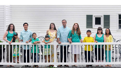 The Clark family at their home in McKeesport: From left, Amanda Barney, 28, Annie, 7, Tyler, 18, Travis, 10, Amelia, 4, Amy, 26, parents Tom, 49, and Mary Ellen, 48, Talbot, 10, Abbey, 21, and Alyssa, 18.