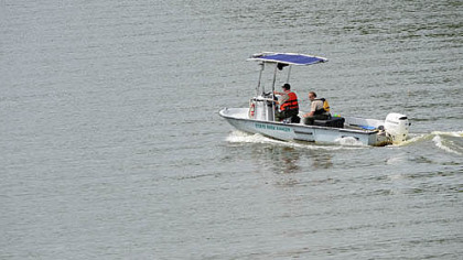 State park rangers search Moraine State Park's Lake Arthur for a missing man Monday. He was later found dead.
