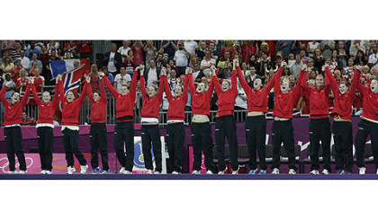 Players of Montenegro celebrate after winning the silver medal in women's handball at the 2012 Summer Olympics, Saturday, Aug. 11, 2012, in London.
