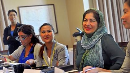 Farah Ibrahim Albastaki, second from right, listens to the welcoming greeting at the entrepreneurship training session at Chatham University Monday. To her right is Bernadette Cruz Herrera-Dy of the Philippines.