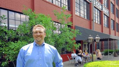 Orrick's Will Turani at the rear courtyard on what once was a railroad spur behind the firm's Wheeling offices.