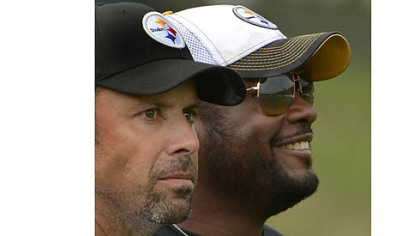 Steelers offensive coordinator Todd Haley alongside head coach Mike Tomlin looking over the new offense during afternoon workouts at training camp.