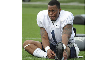 Penn State running back Bill Belton stretches at practice.